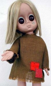 Little Miss No Name complete wth potato sack dress, ratty hair, sad eyes with a tear and outstretched hand as if to beg.  How could you leave her sitting on the shelf?