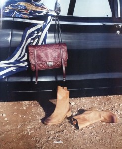 A twist on the Classics can't be all bad. Love the bag & distressed boots - Chanel.