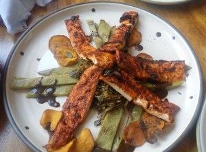 Chicken breast marinated with purslane, cactus and sweet potato chips with black mole.