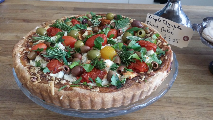 Roasted Tomato, Goat Cheese, Olive & Basil Tart. $6.99 slice