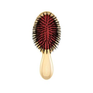 Aerin Travel Gold Hairbrush, $75; aerin.com