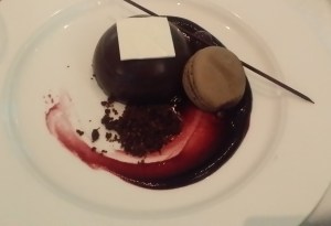 delicious chocolate mousse dessert with macaron