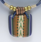 a necklace incorporating polymer clay with a western design
