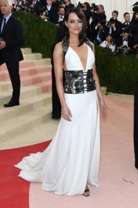 Emma Stone melds Old Hollywood elegance with high fashion in a corset detail dress by Prada.