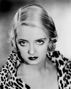 Bette Davis & her eyes wearing a classic leopard-print something or other.