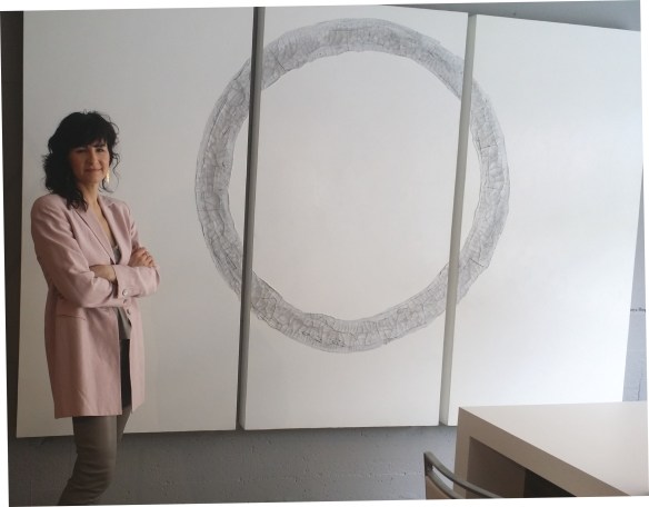 Tanya Slingsby stands beside one of her amazing works of ART