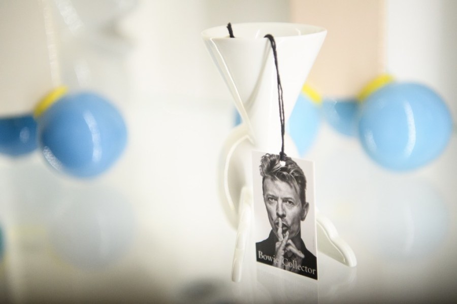 A photo of David Bowie on the auction labels of items during the press preview of the 
