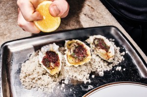 The oysters, about to be spritzed with lemon.Photo: Bobby Doherty/New York Magazine
